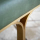 Green leather bench with brushed gold legs